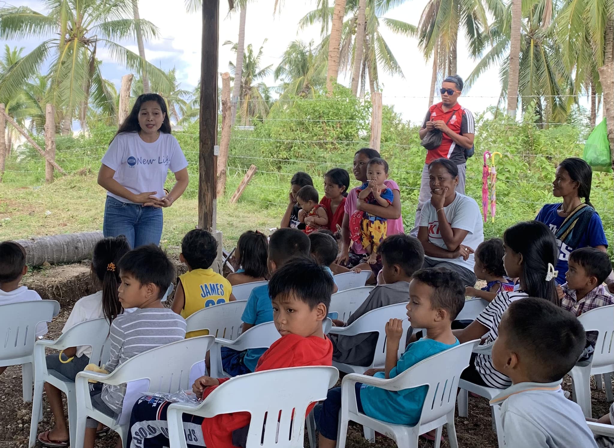 Children and adults together during an outdoor learning session
