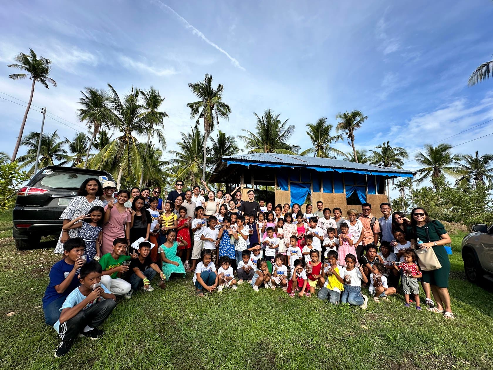 Seeds of Life Global community members gathered with children outdoors in Cebu