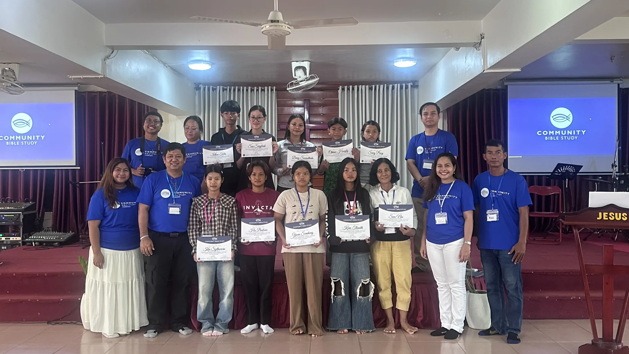 Participants holding certificates after a group training session