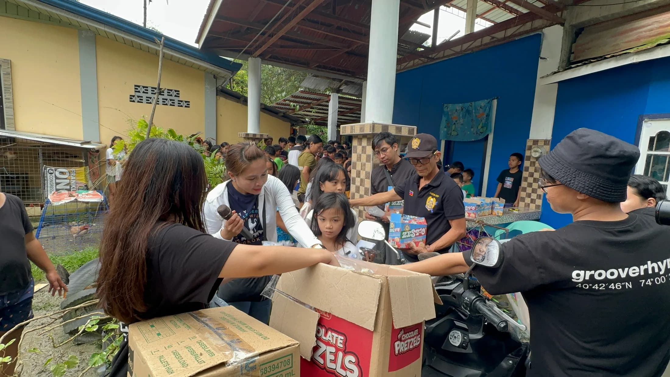 Volunteers preparing supplies at an outdoor table