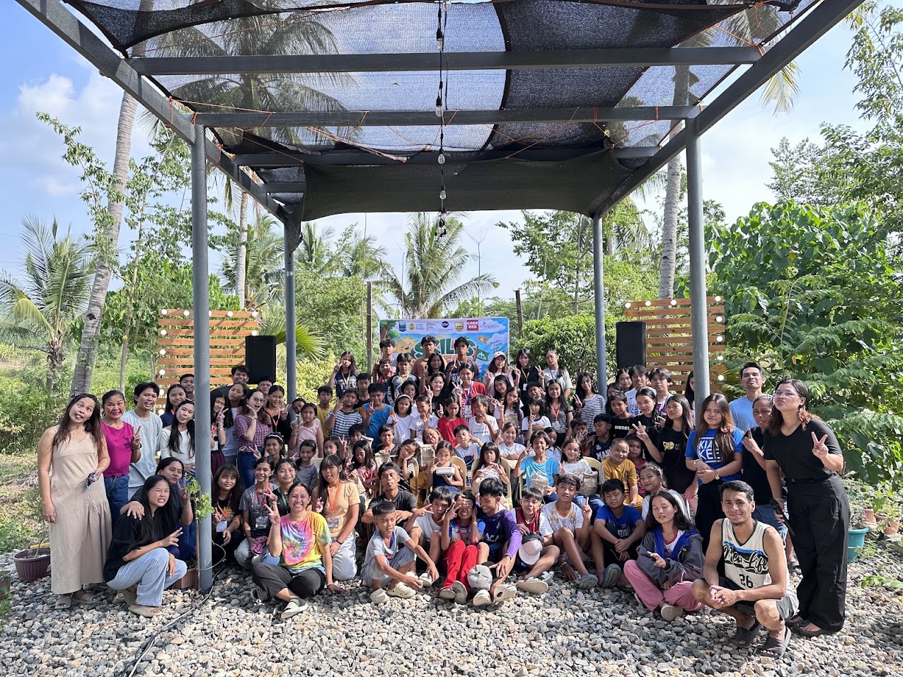 Children and adults gathered beneath a shelter at Mt. Moriah